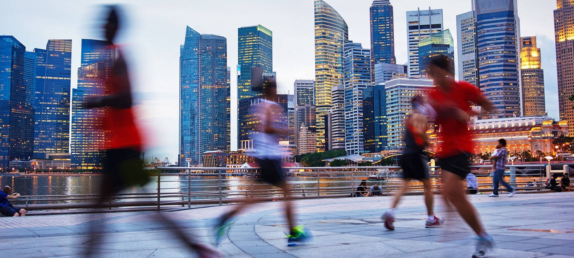 City skyline and blurred people running